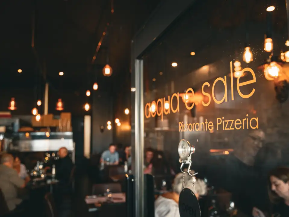 Acqua e Sale Ristorante Pizzeria signage seen through the dining room entrance