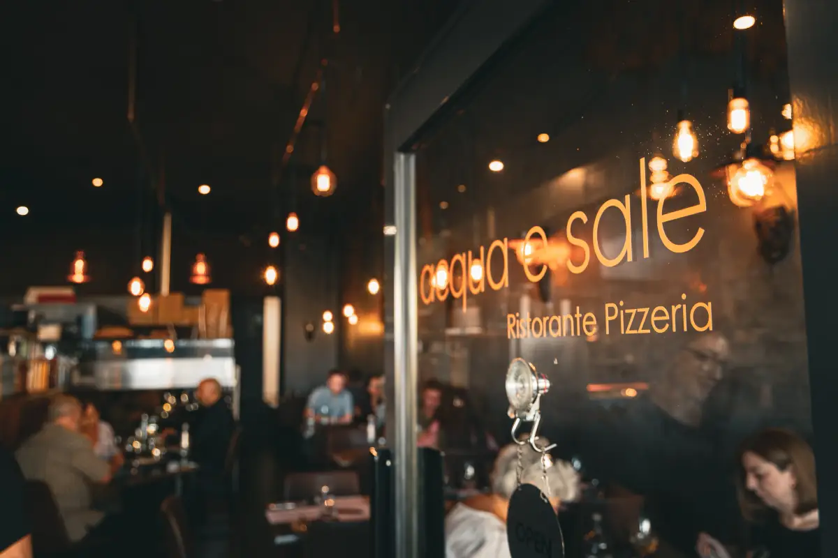 Acqua e Sale Ristorante Pizzeria signage seen through the dining room entrance