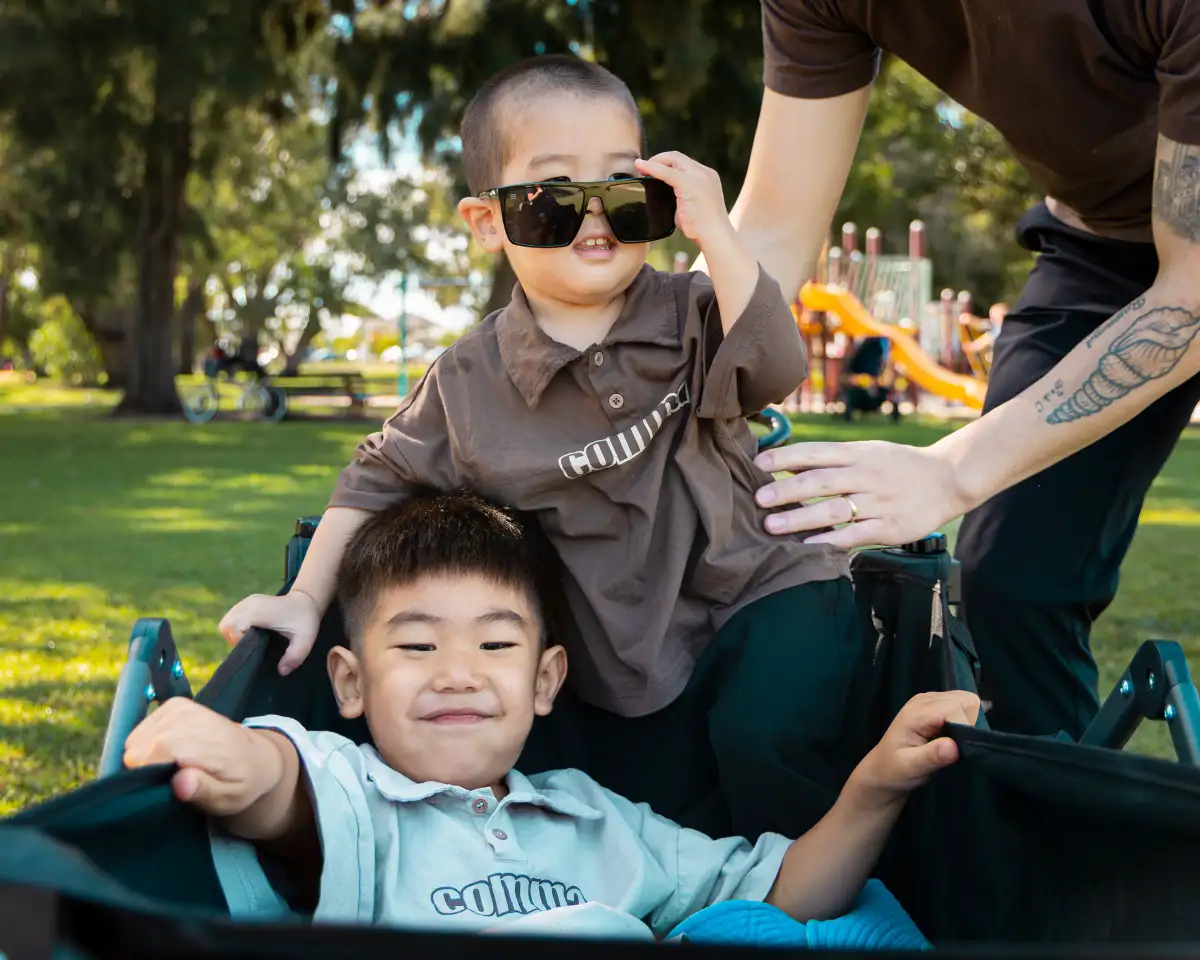 Children photographed together during a relaxed outdoor family session.