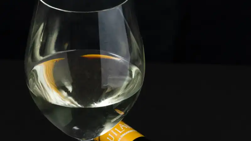 Professional packshot of a WA craft beverage bottle with natural ingredients styled around it.