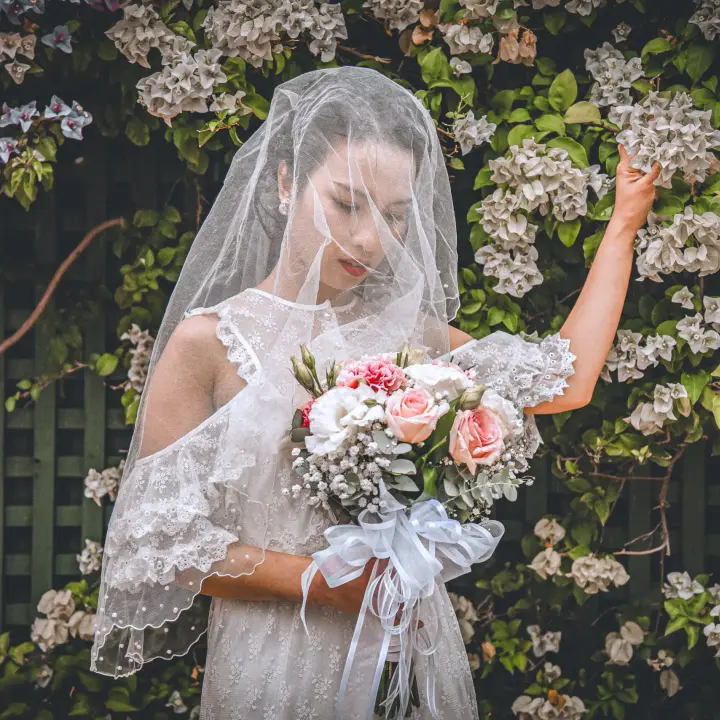 Bride portrait through veil and flowers during an intimate Perth wedding.