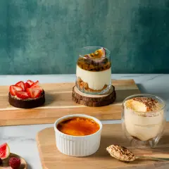 Plated trio of crème brûlée, tart, and mousse, professional pastry photography for Perth bakery website layouts.