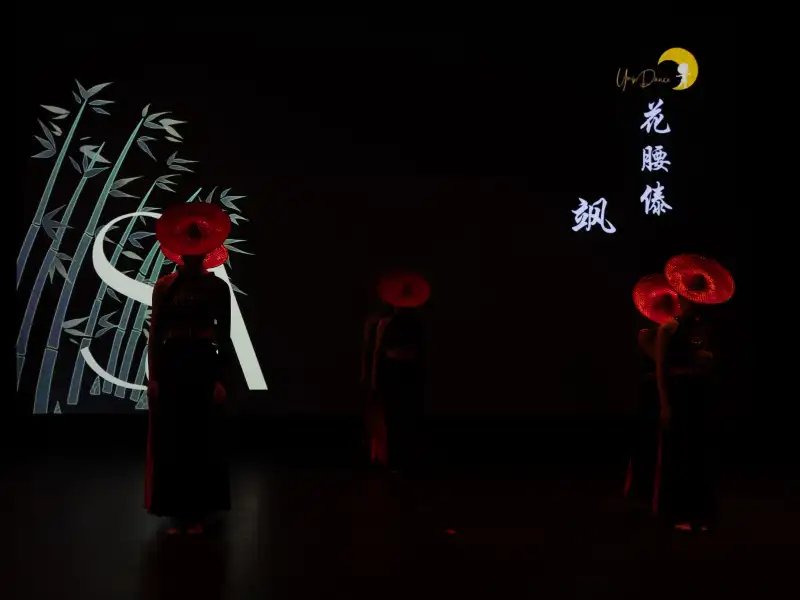 Indoor event photographed in low light with stage lighting atmosphere