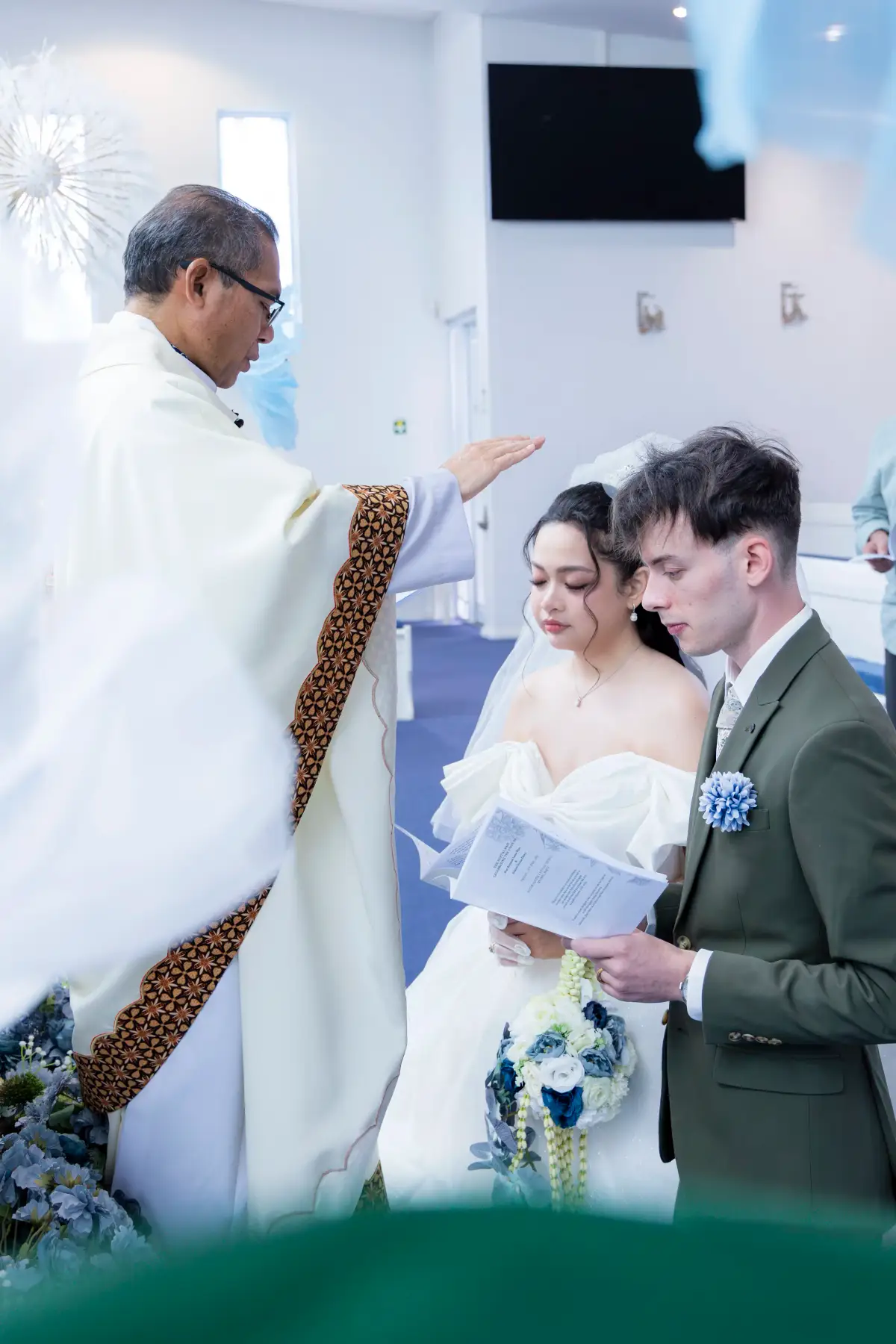 Close-up of the bride during a church reading at Pater Noster Catholic Church in Myaree