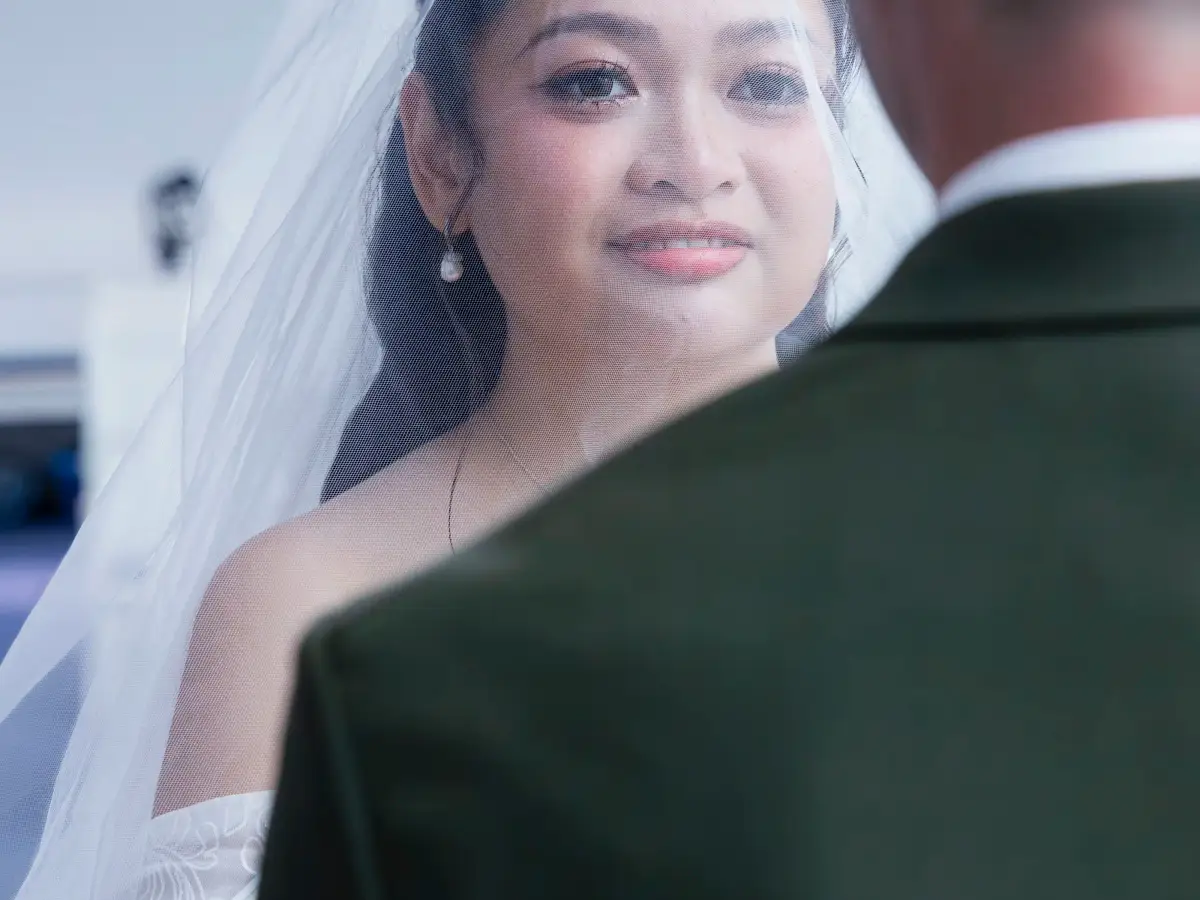 Bride photographed through her veil during the wedding ceremony at Pater Noster Catholic Church
