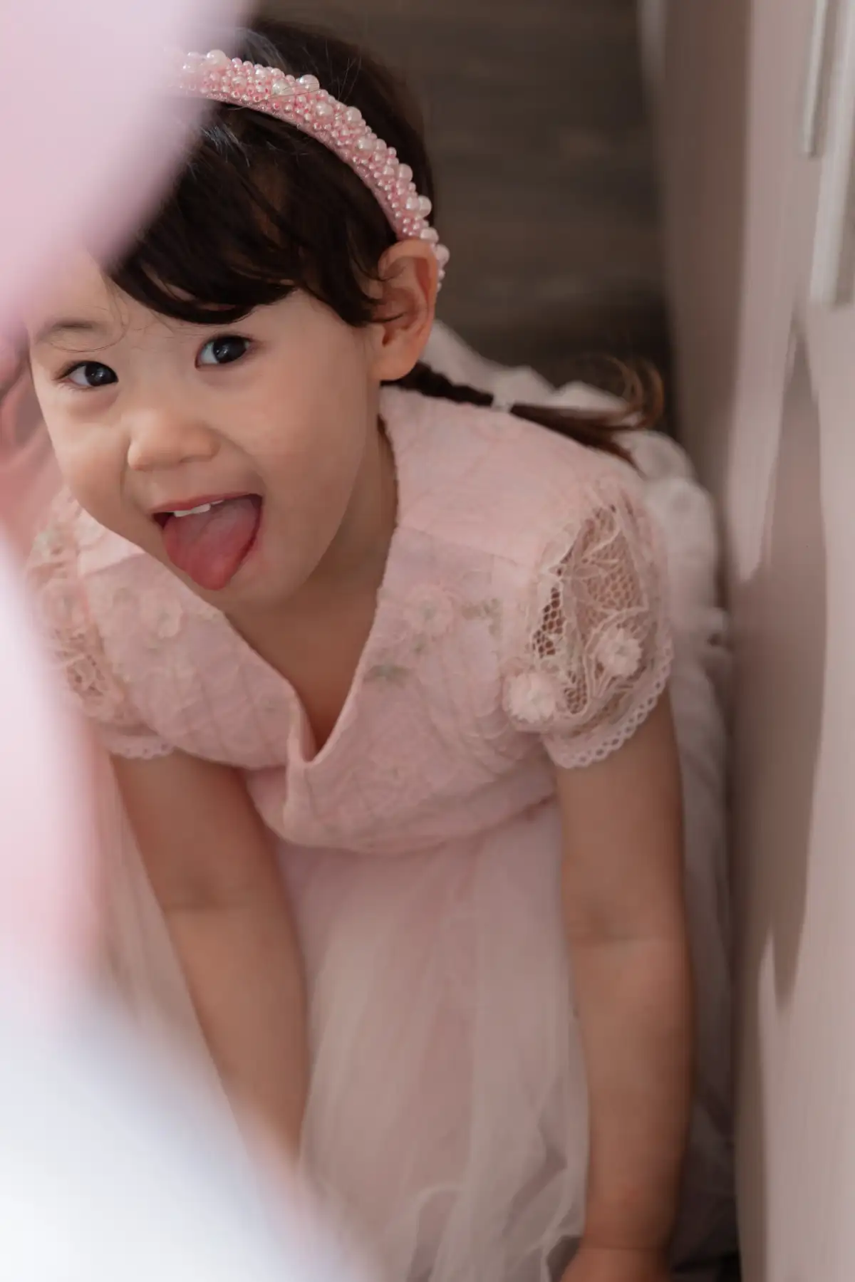Child smiling during a candid birthday party portrait.