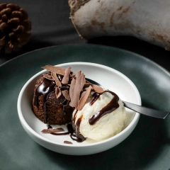 Molten chocolate lava cake with vanilla ice cream, high-contrast dessert photography for Perth restaurant menu and marketing.