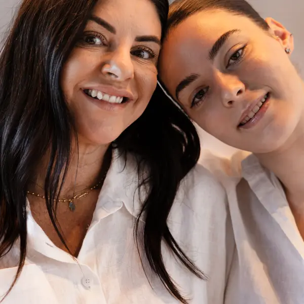 Close studio portrait of two people photographed in Perth.