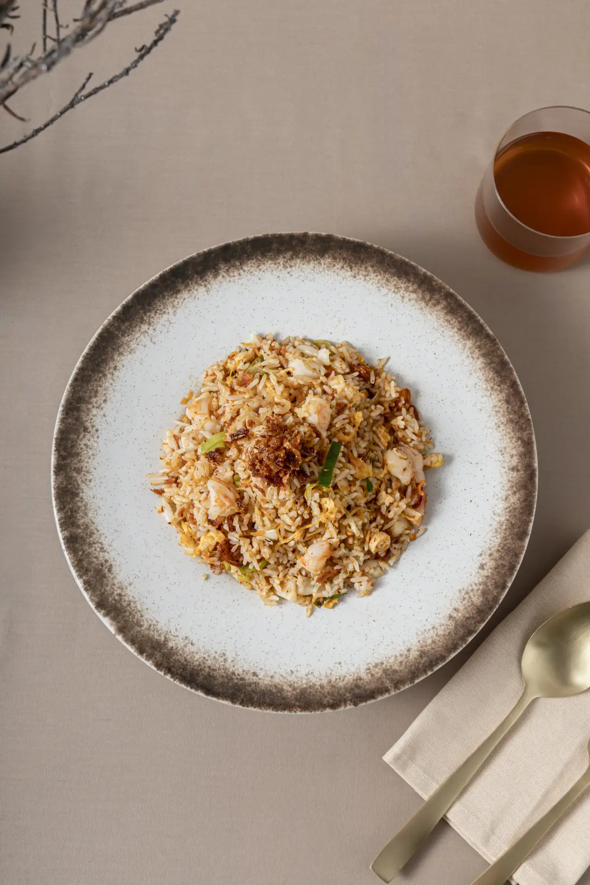 Overhead fried rice plate with tea and table styling at Como Garden Restaurant