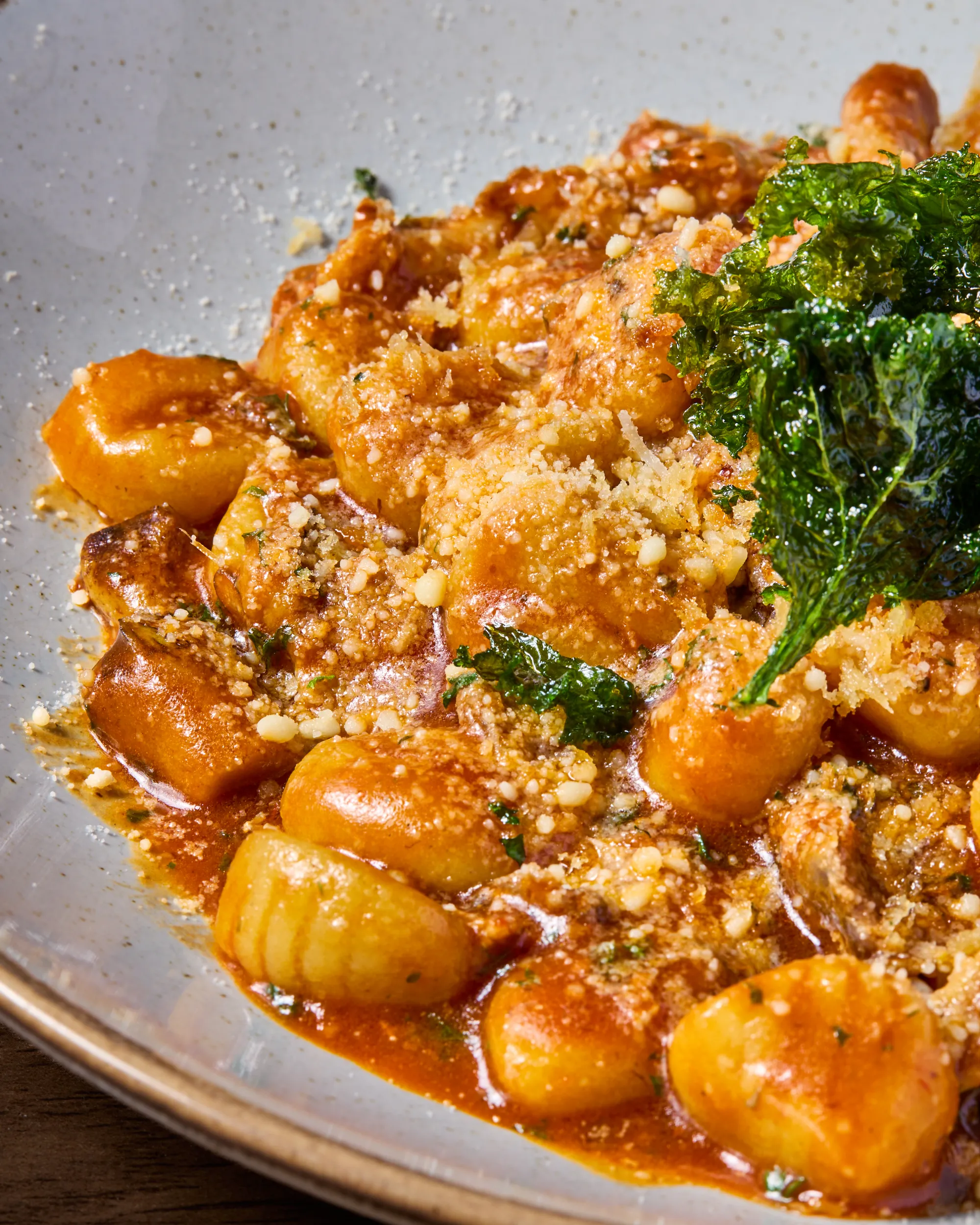 Duck ragu gnocchi with herbs and crispy garnish at Acqua e Sale