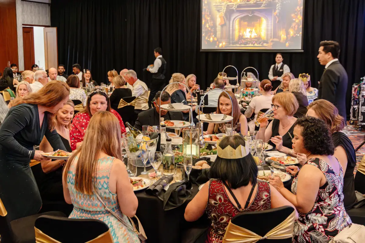 Guests dining at decorated tables during a festive ballroom event at Duxton Hotel Perth