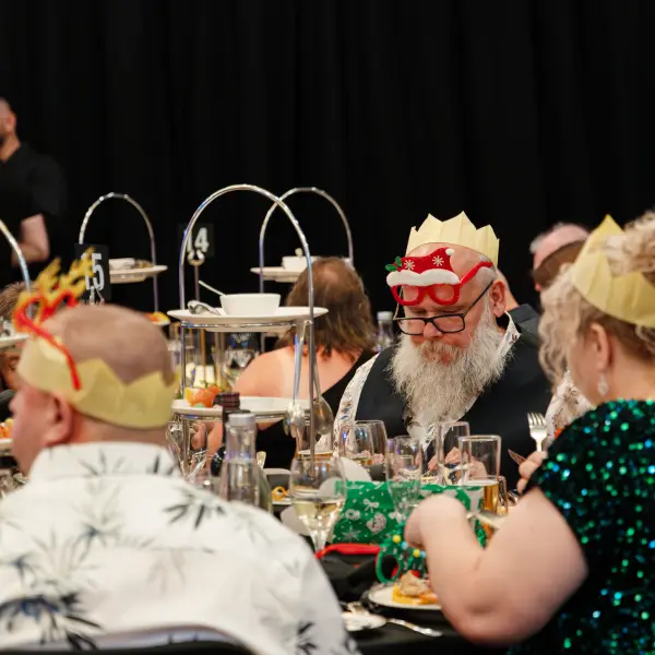 Guests seated during a formal ballroom dinner