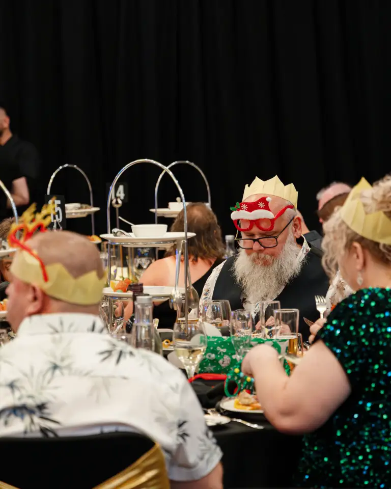 Guests dining at a formal Duxton Hotel event in Perth.