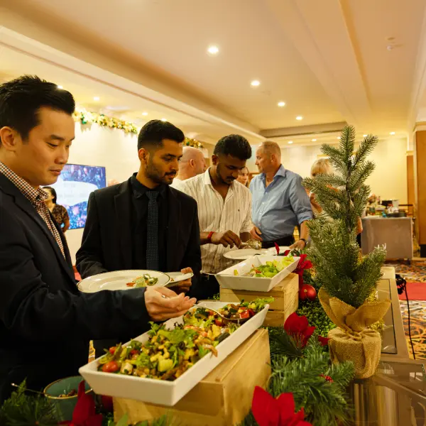 Guests moving through catered service photographed for catering photography in Perth.
