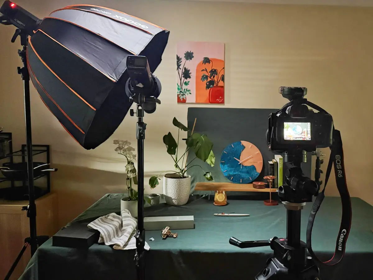 Behind-the-scenes product photography studio setup for Empire Copper with softbox lighting, camera, and styled copper homeware