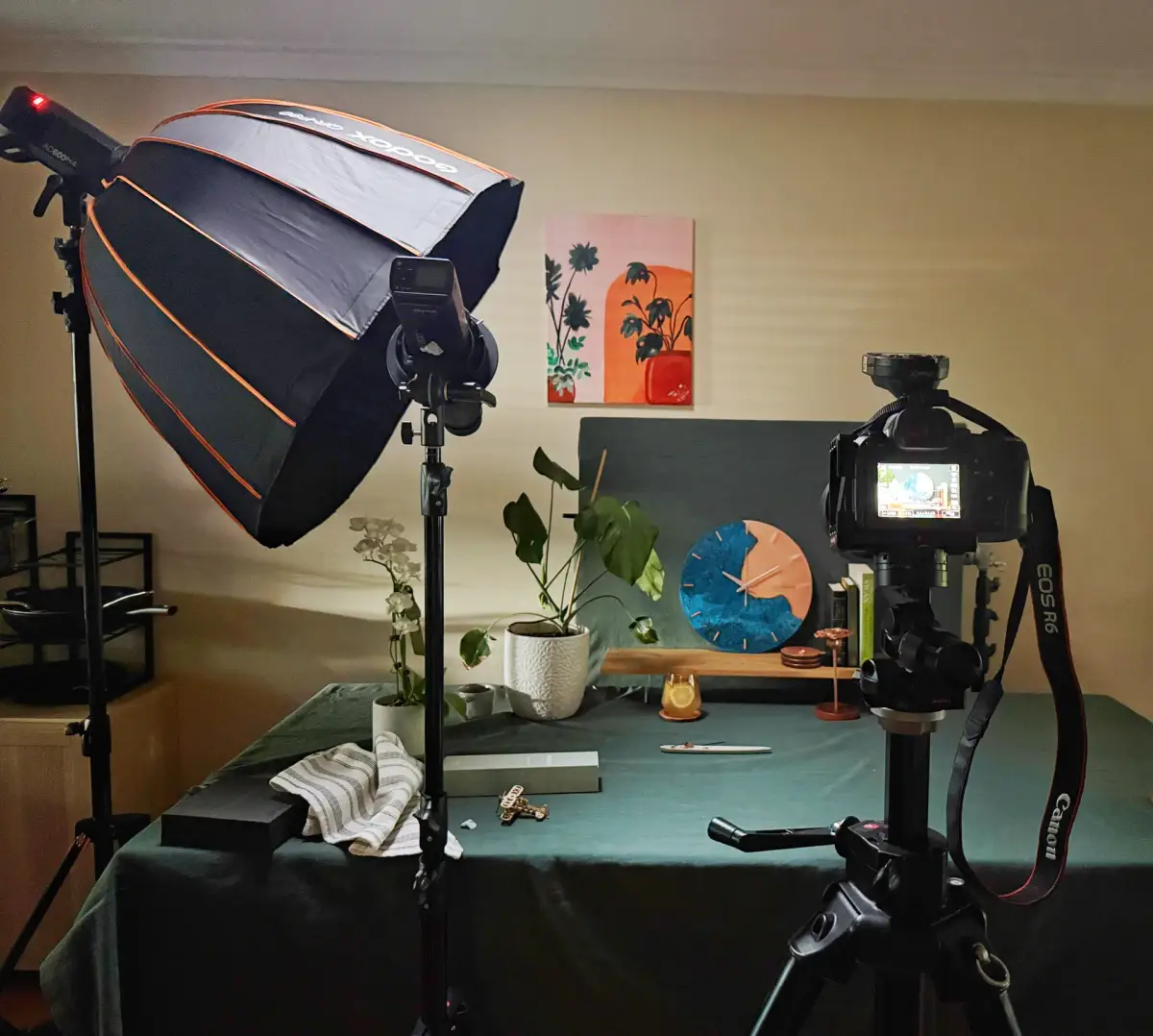 Behind-the-scenes product photography studio setup for Empire Copper with softbox lighting, camera, and styled copper homeware