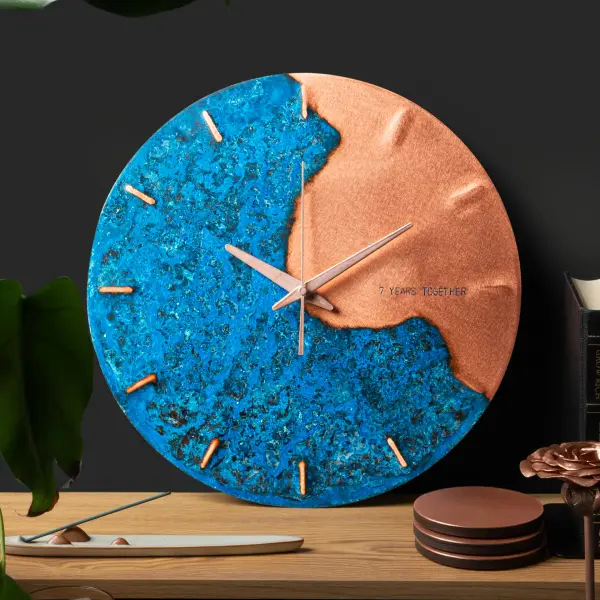 Empire Copper wall clock styled on a shelf for a product detail page.