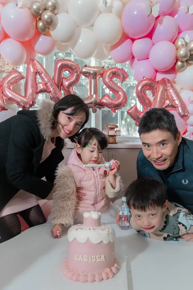 Family birthday cake celebration photographed at a Perth private event