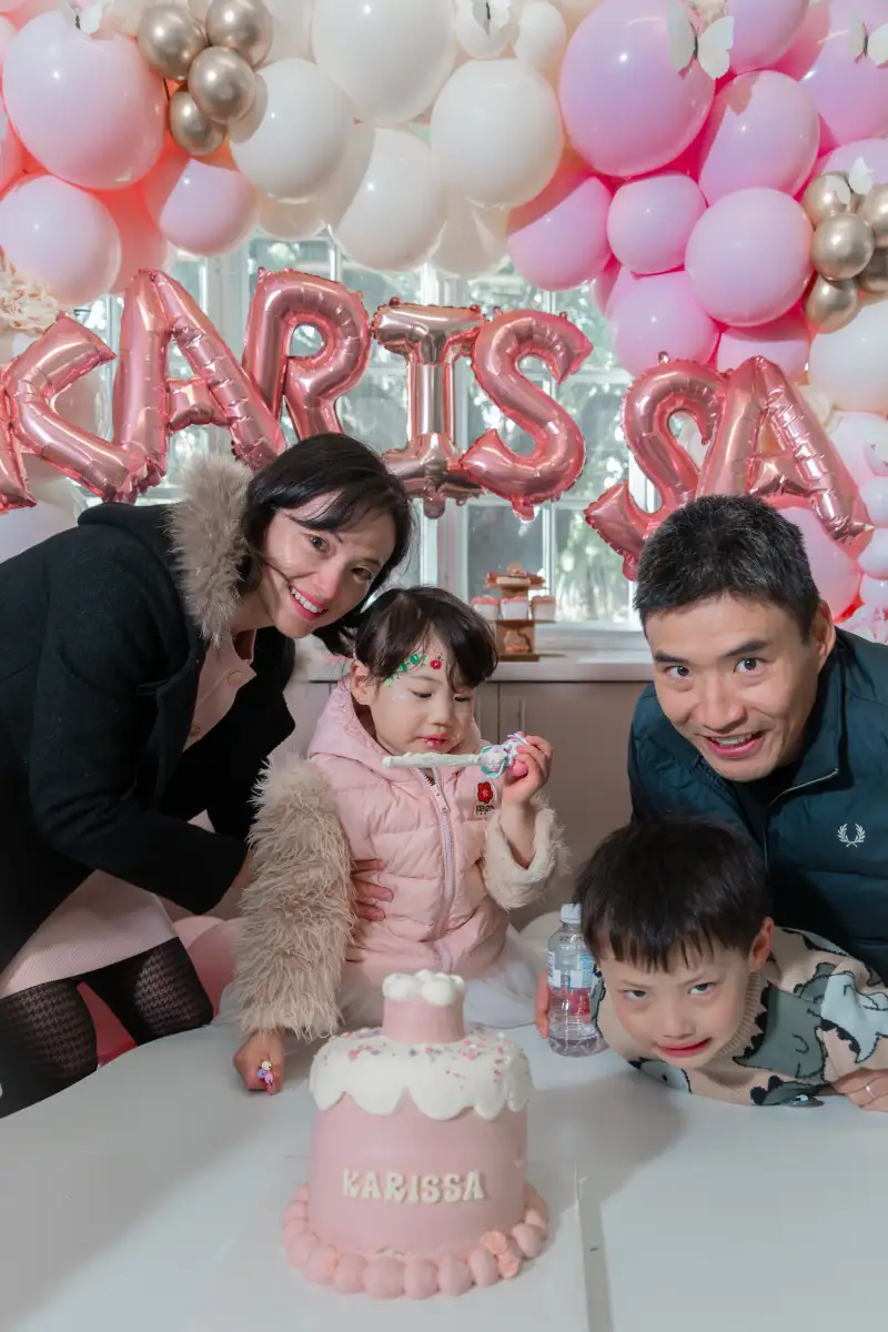 Family gathered around a birthday cake at a private Perth celebration.