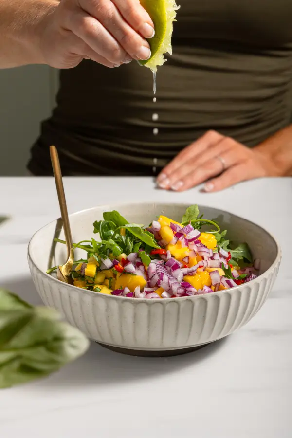 Fresh mango salad with vibrant colours, culinary photography for Perth brunch menus.