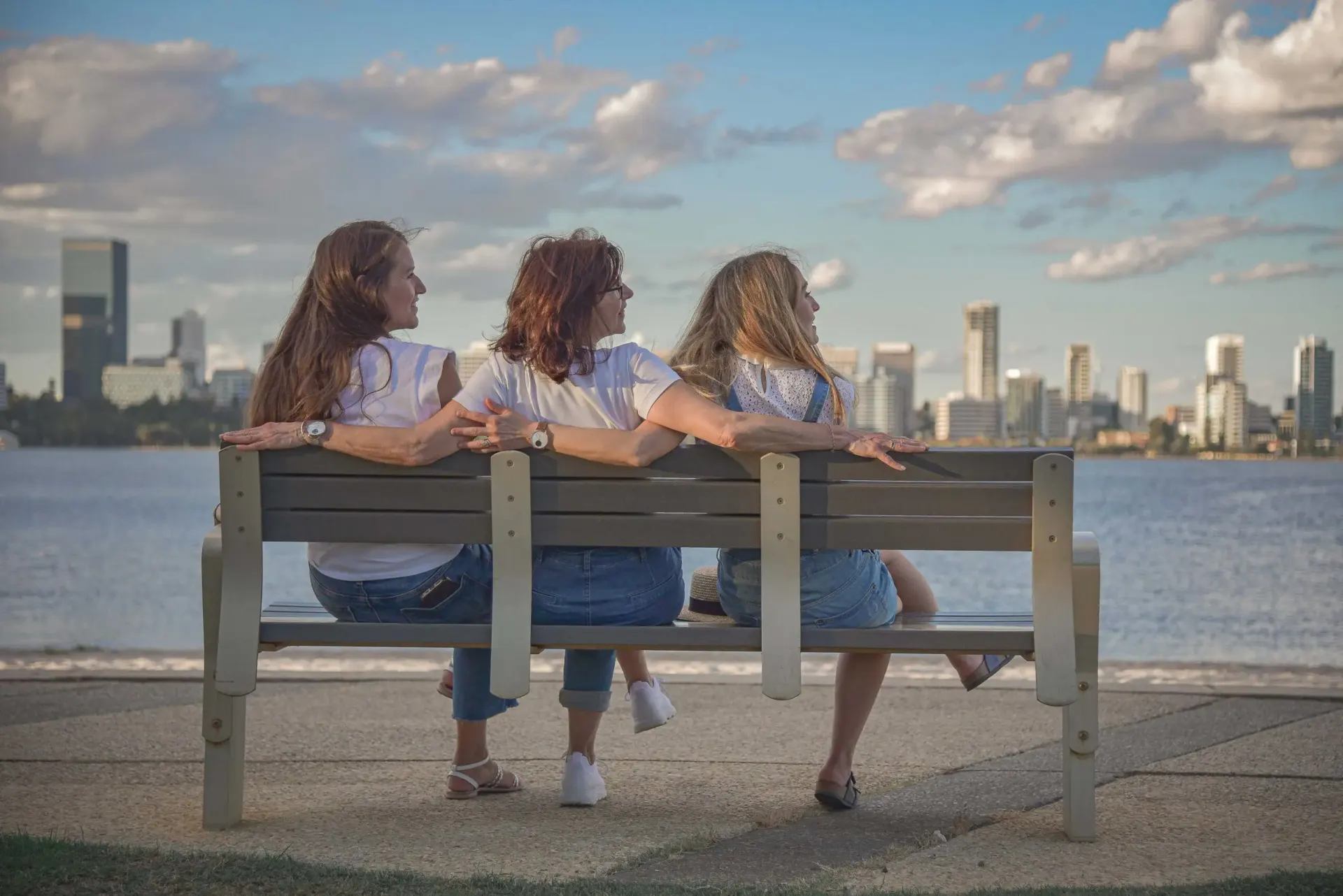 Friends together at sunset and a child enjoying a Perth birthday celebration.