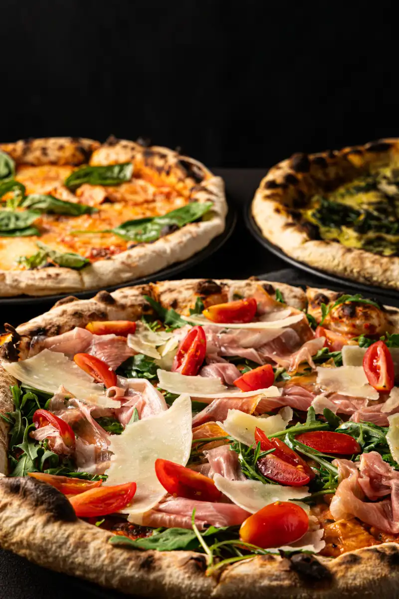 Gourmet pizzas photographed at a Perth restaurant, the type of menu item that benefits from schema markup in search results