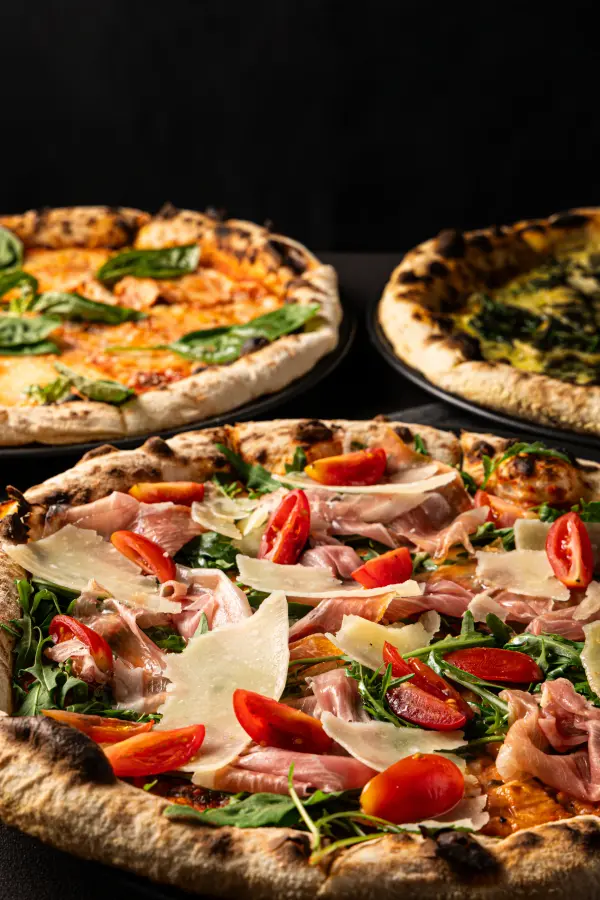 Gourmet pizzas fresh from the oven, casual cafe dining photography in Perth.