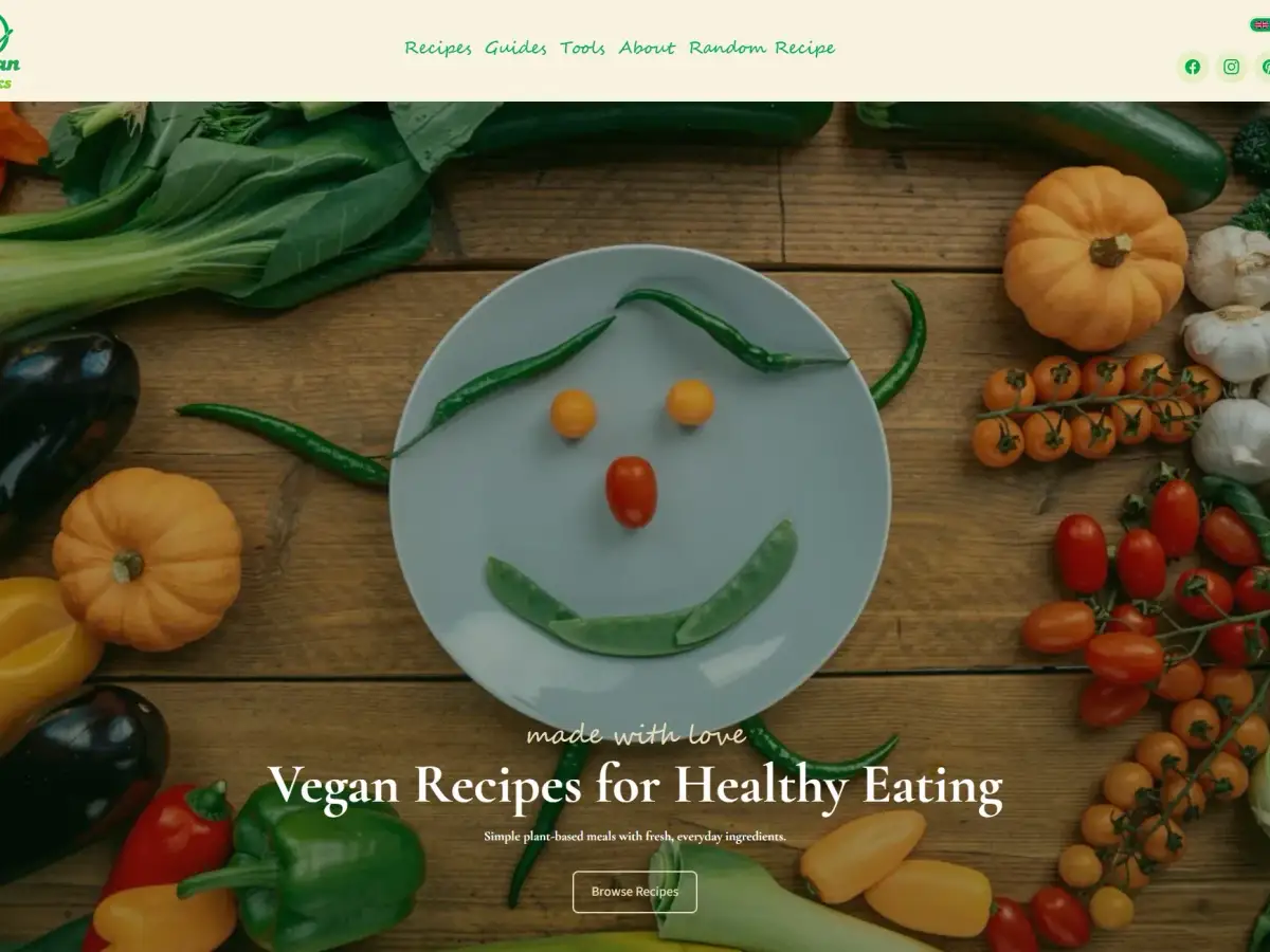 Vegan Hacks website homepage with vibrant plant-based recipe visuals and a bold, content-first layout