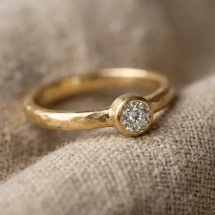 Gold ring close-up showing gemstone clarity and handcrafted texture