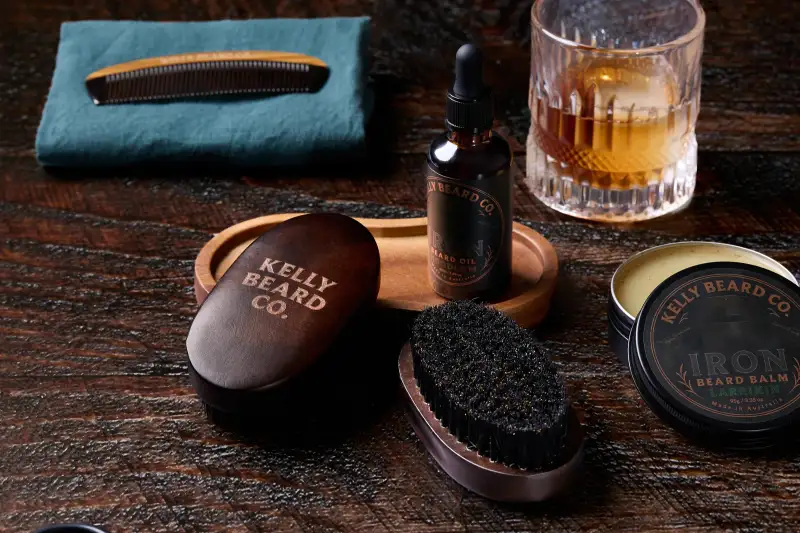 Beard-care products arranged in a branded lifestyle composition.