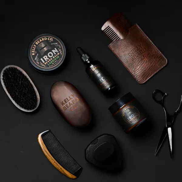 Dark grooming-product range arranged consistently in a branded flatlay.