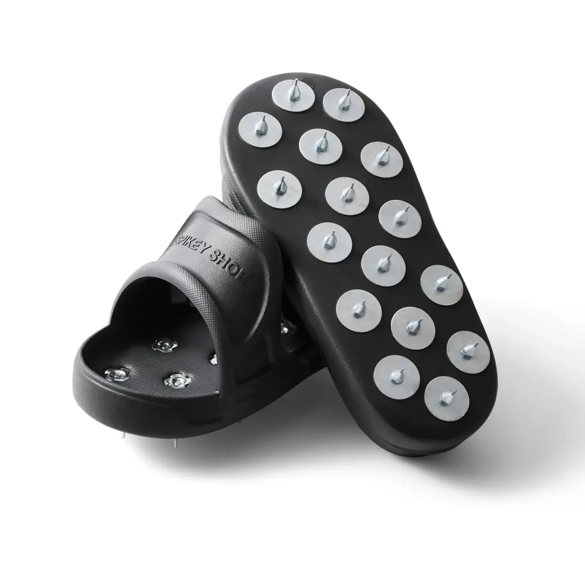 Pair of black Kevmor Spikey flooring shoes showing the metal-spiked soles on a white background