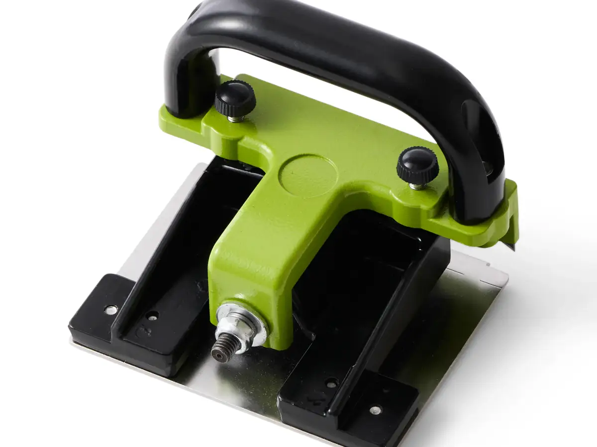 Green and black Kevmor UFS7733 professional flooring tool with adjustable handle photographed on white
