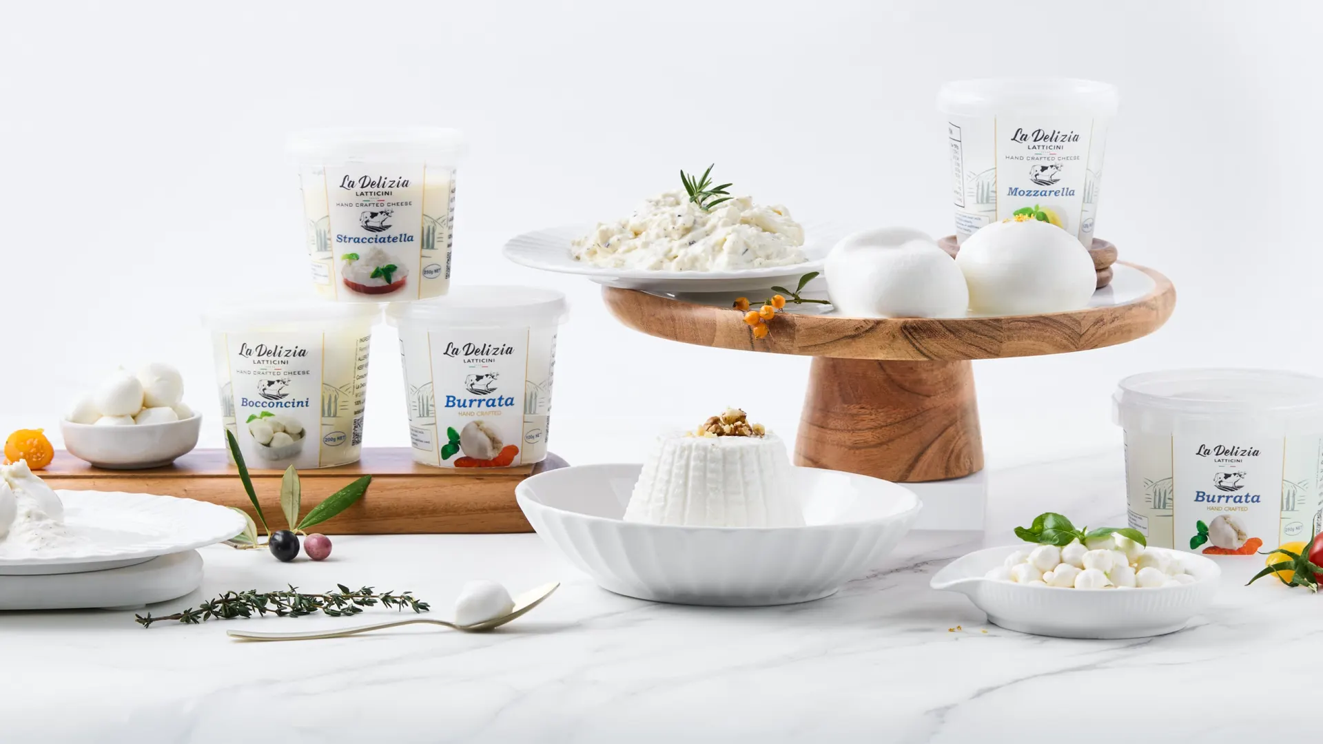 Italian burrata, mozzarella and ricotta product range styled on marble, commercial product photography in Perth, WA.