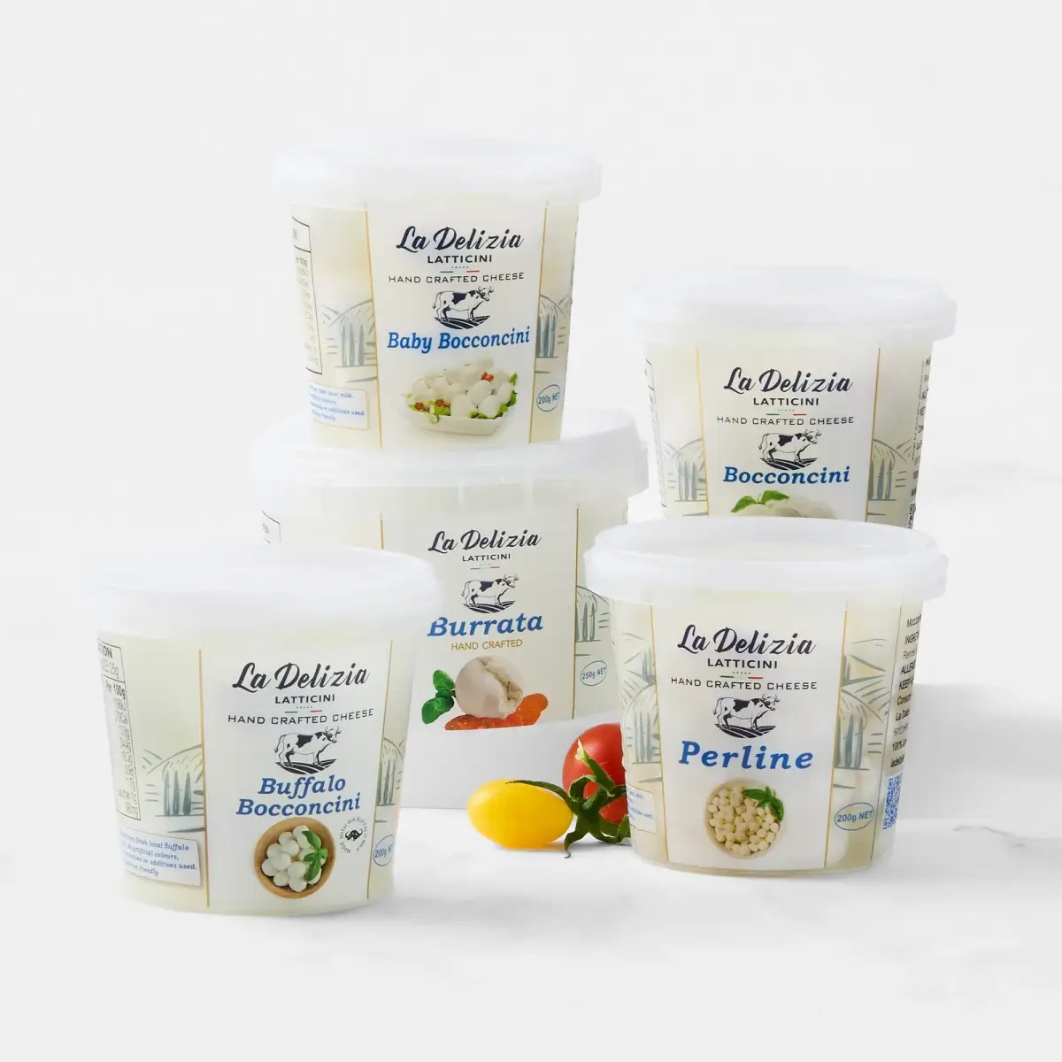 La Delizia Latticini retail cheese tubs including Baby Bocconcini, Bocconcini, Burrata, Buffalo Bocconcini, and Perline with fresh tomato