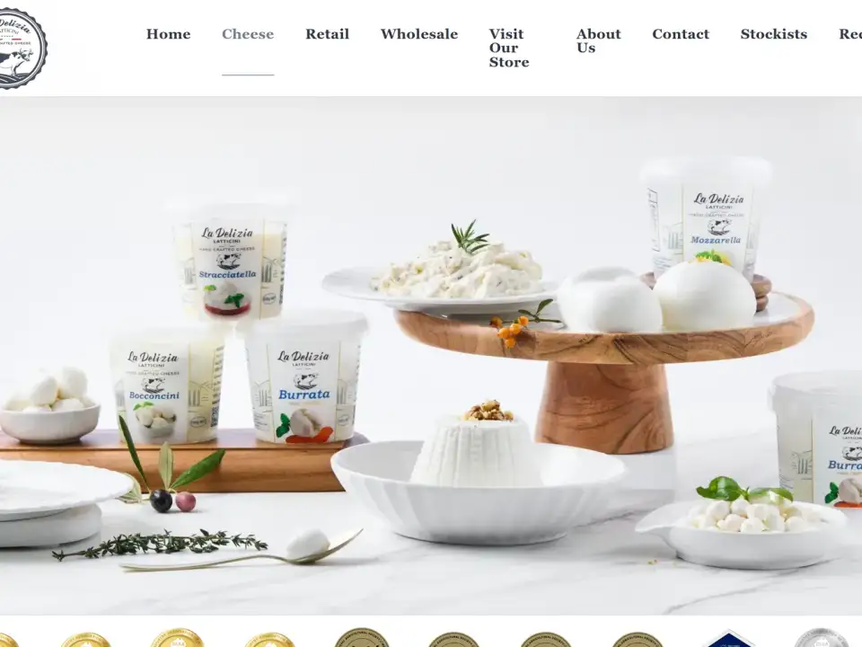 La Delizia Latticini website product page for smoked scamorza log showing food service format and weight against a clean navy and white identity