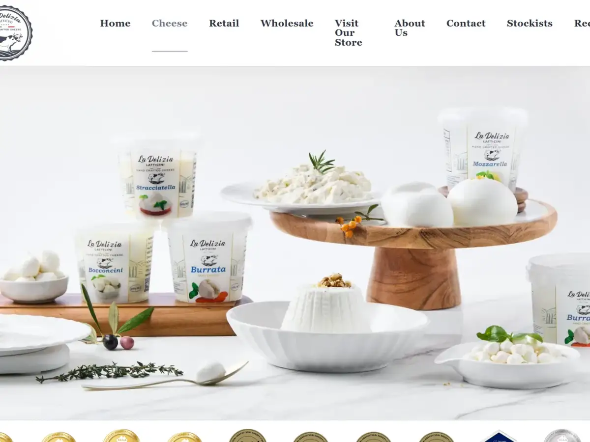 La Delizia Latticini website product page for smoked scamorza log showing food service format and weight against a clean navy and white identity