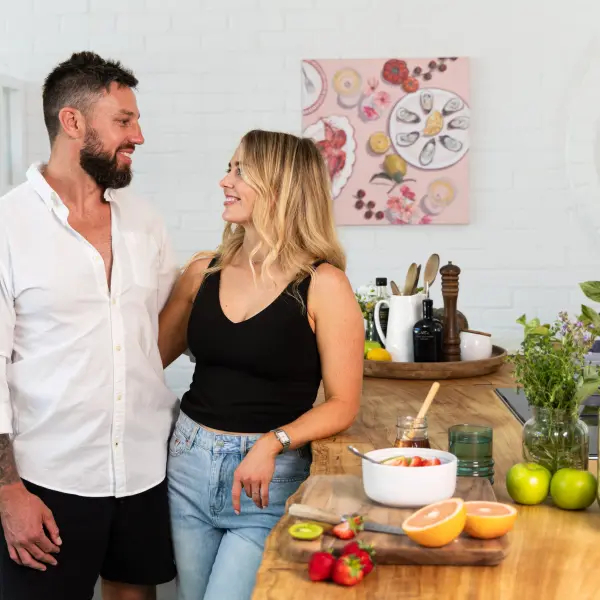 Couple photographed together in a bright lifestyle setting.