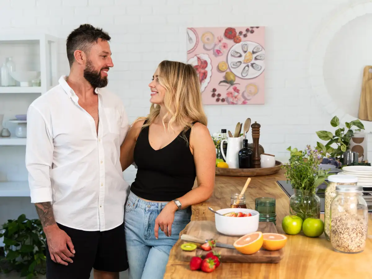 Couple photographed together in a bright lifestyle setting.