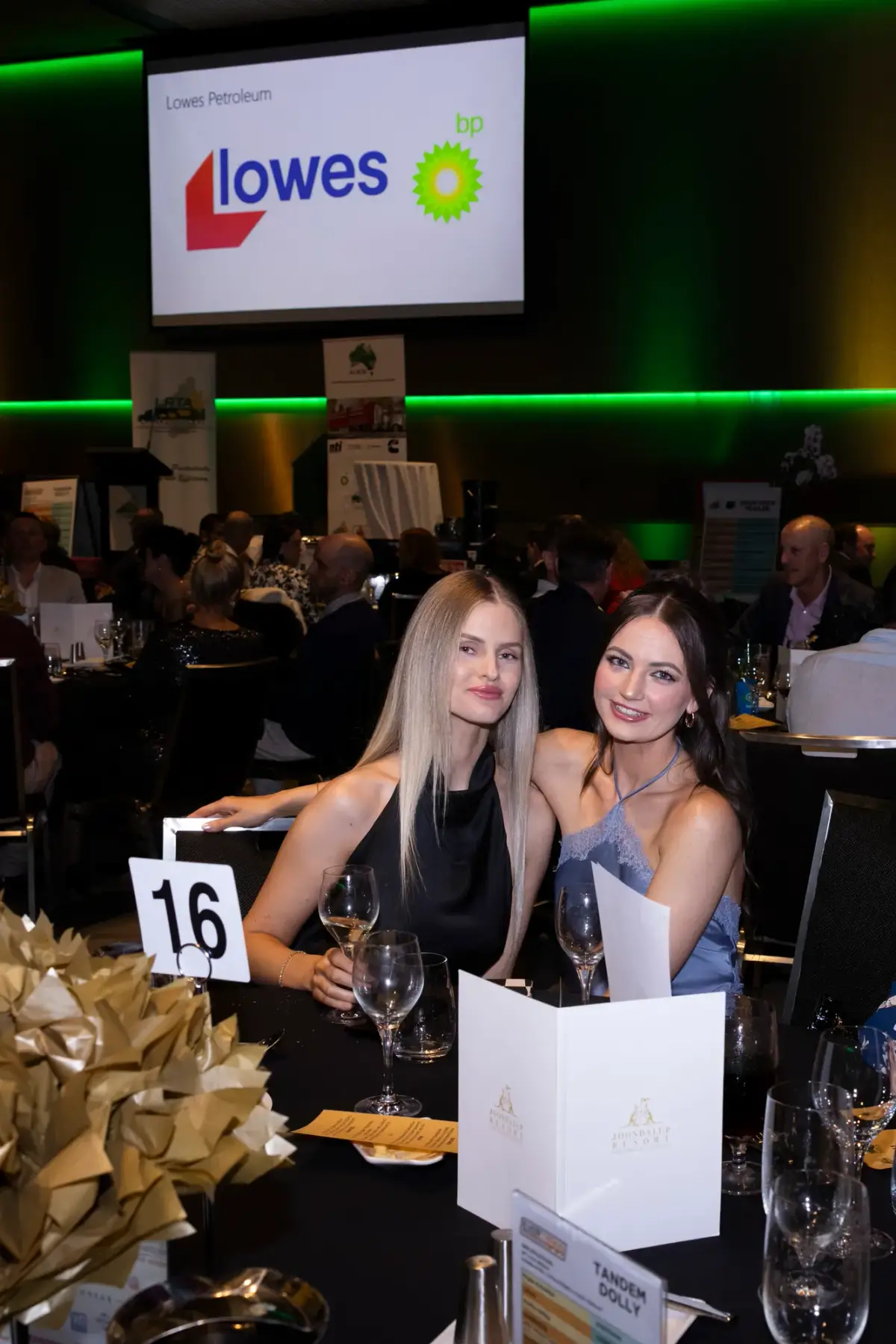 Two guests seated at a gala dinner table at LRTAWA Corporate Event.