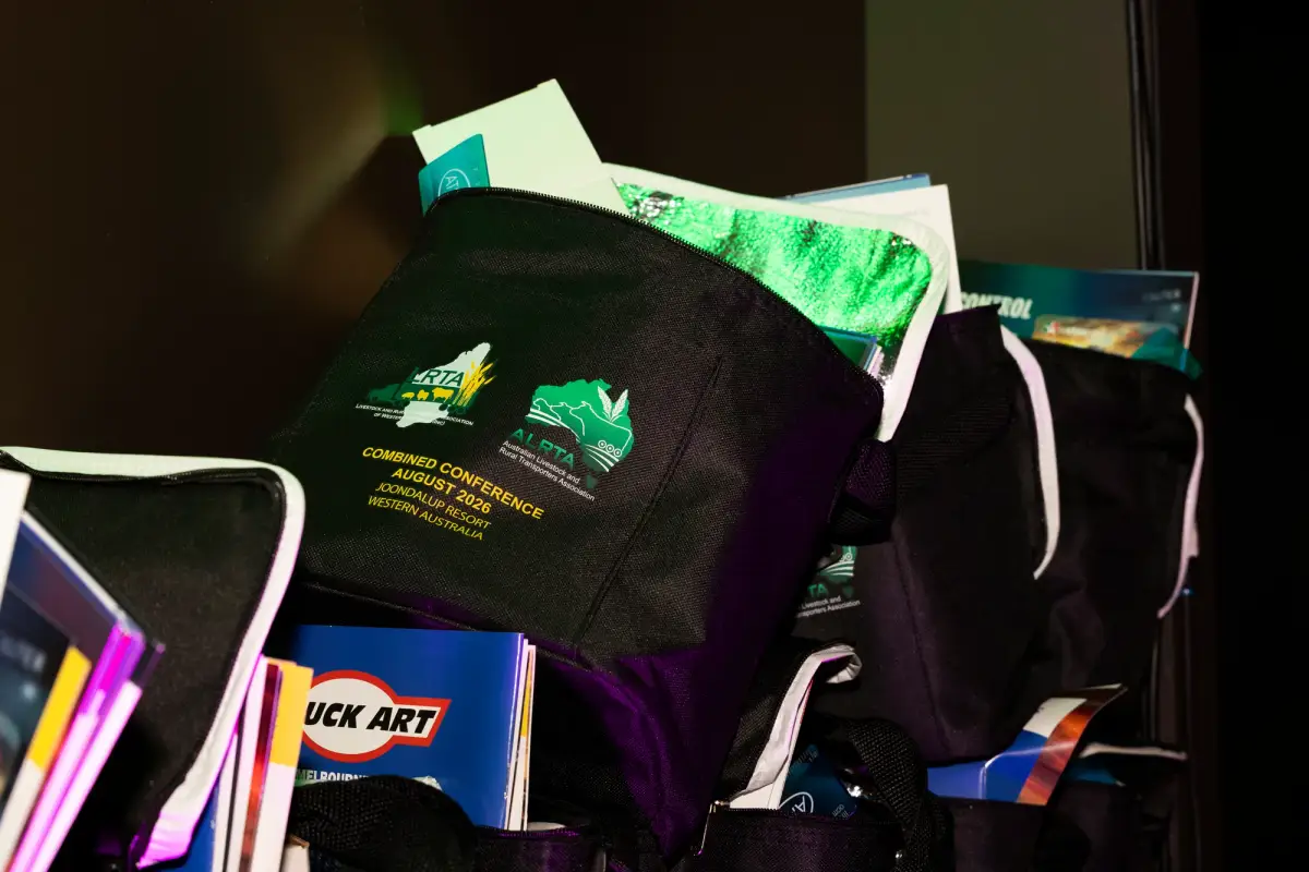 Branded caps and sponsor gift bags prepared for attendees at LRTAWA Corporate Event.