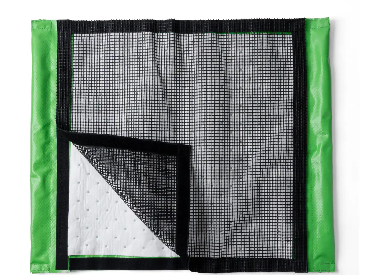 Lubie green and black spill-containment mat opened to show the mesh top and absorbent inner layer