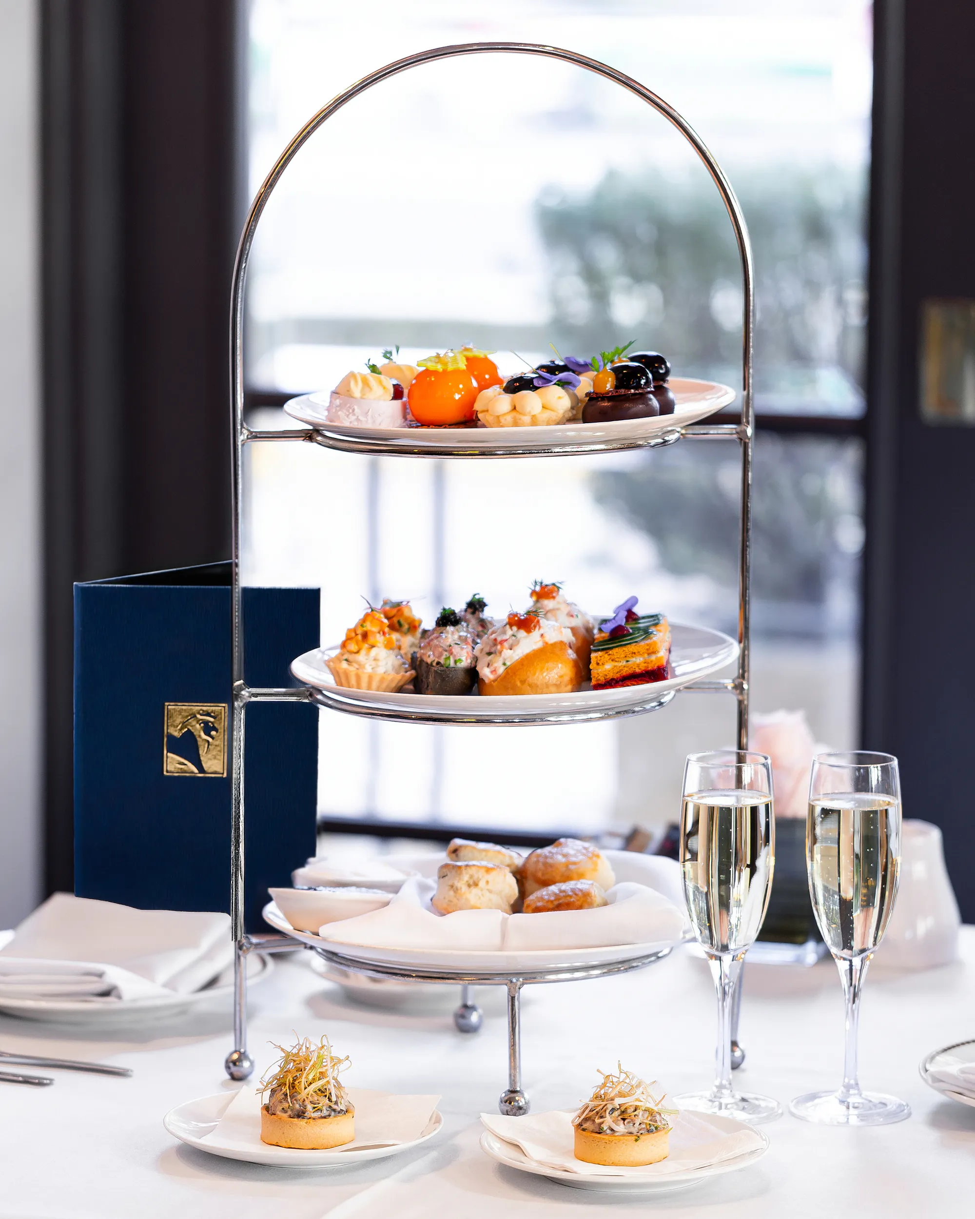 Luxury high tea dessert stand with champagne at Duxton Hotel Perth