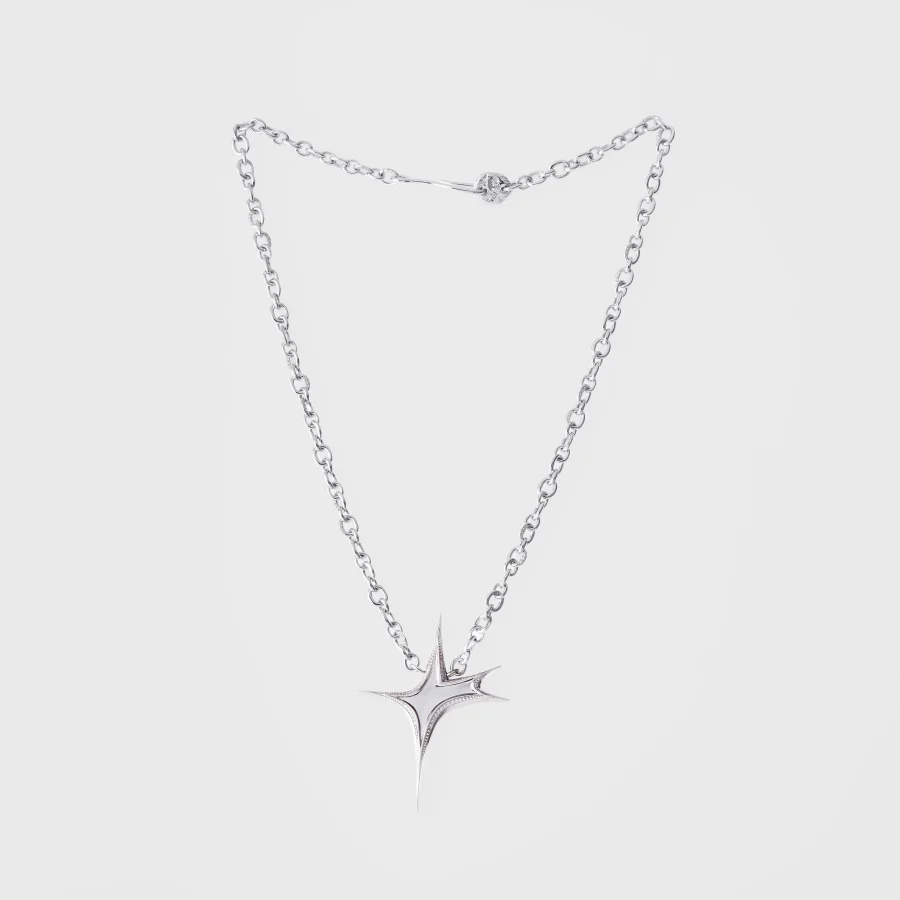 Silver diamond-set star pendant necklace photographed on a clean light background