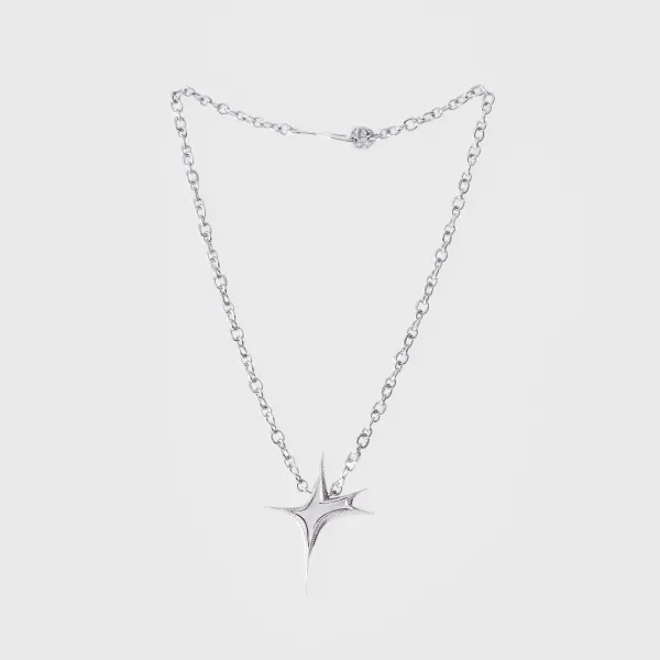 Silver diamond-set star pendant necklace photographed on a clean light background.