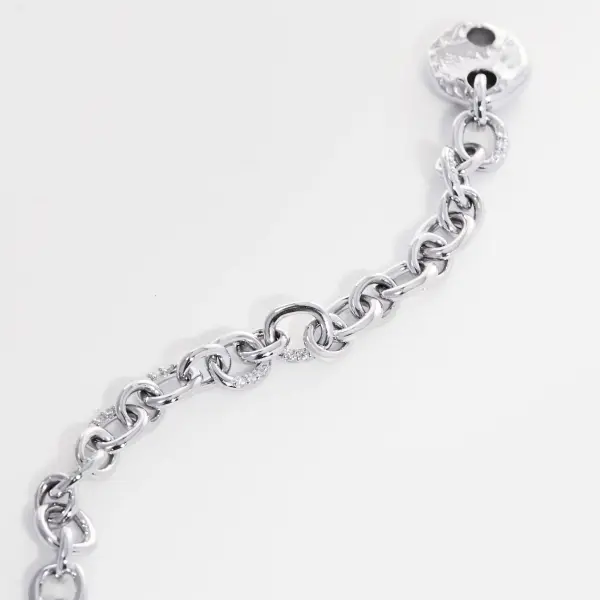 Fine silver diamond necklace photographed close up to show chain links and reflective finish.