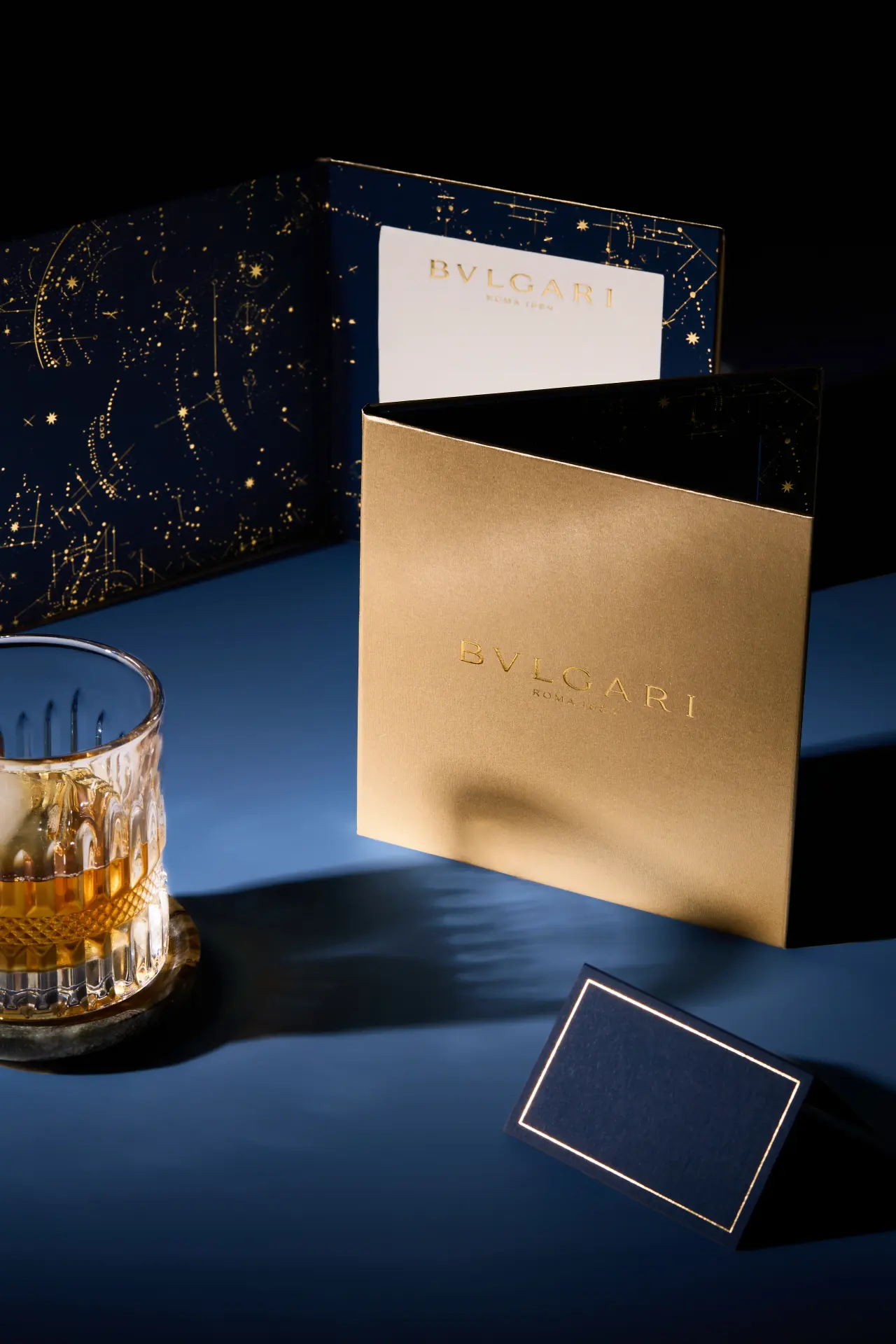 BVLGARI invitation box styled with premium packaging, printed card details and glassware for luxury product photography in Perth.