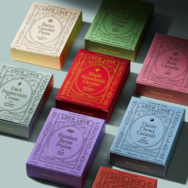 Loco Love artisan chocolate boxes arranged under dramatic directional light.