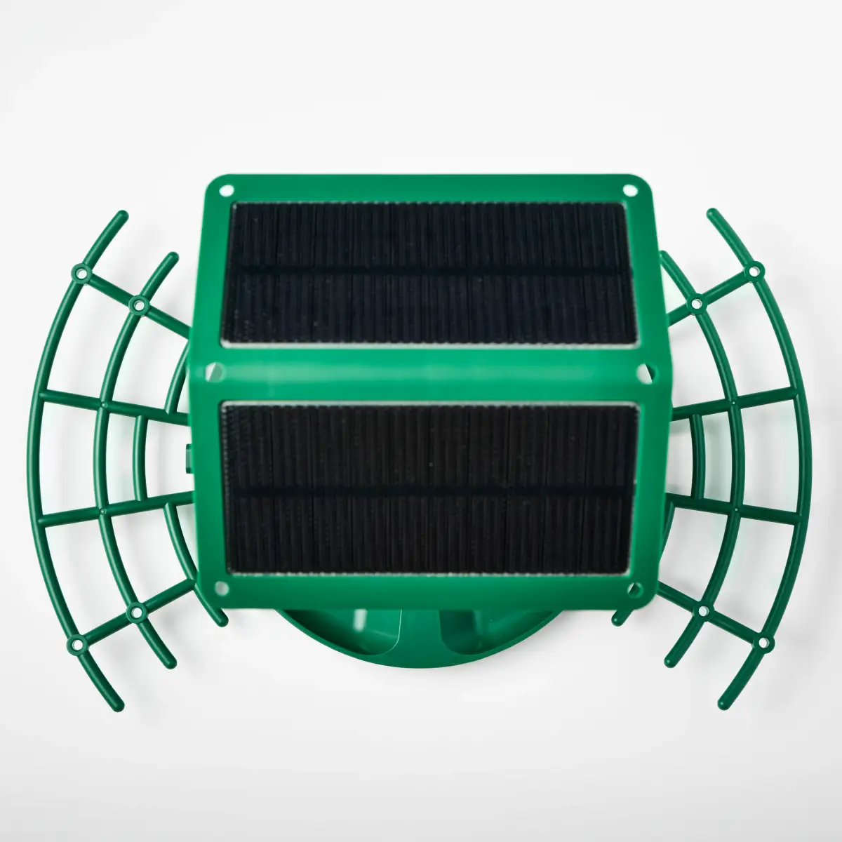 Overhead view of two dark solar panels on the green Nexavian bird feeder roof with the feeding platform visible around it