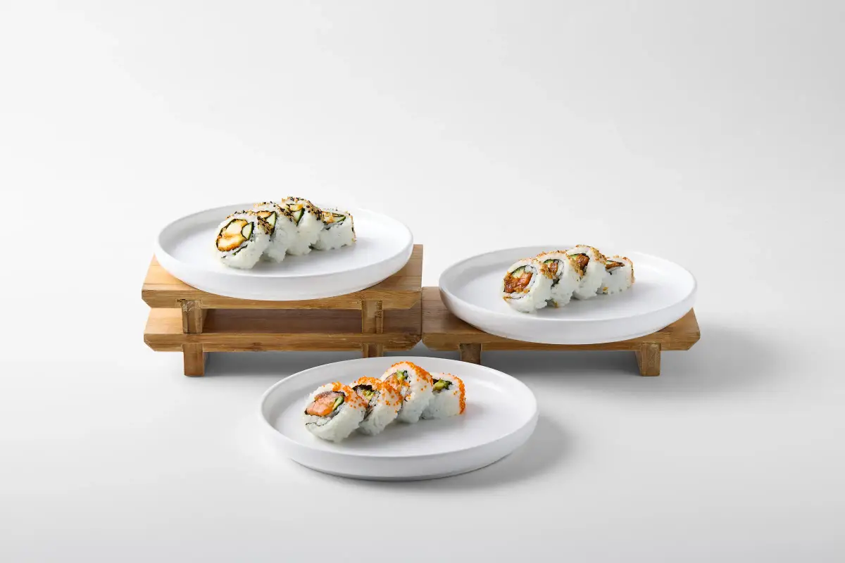 Omasa Japanese Restaurant sushi rolls plated separately for menu photography on a white background